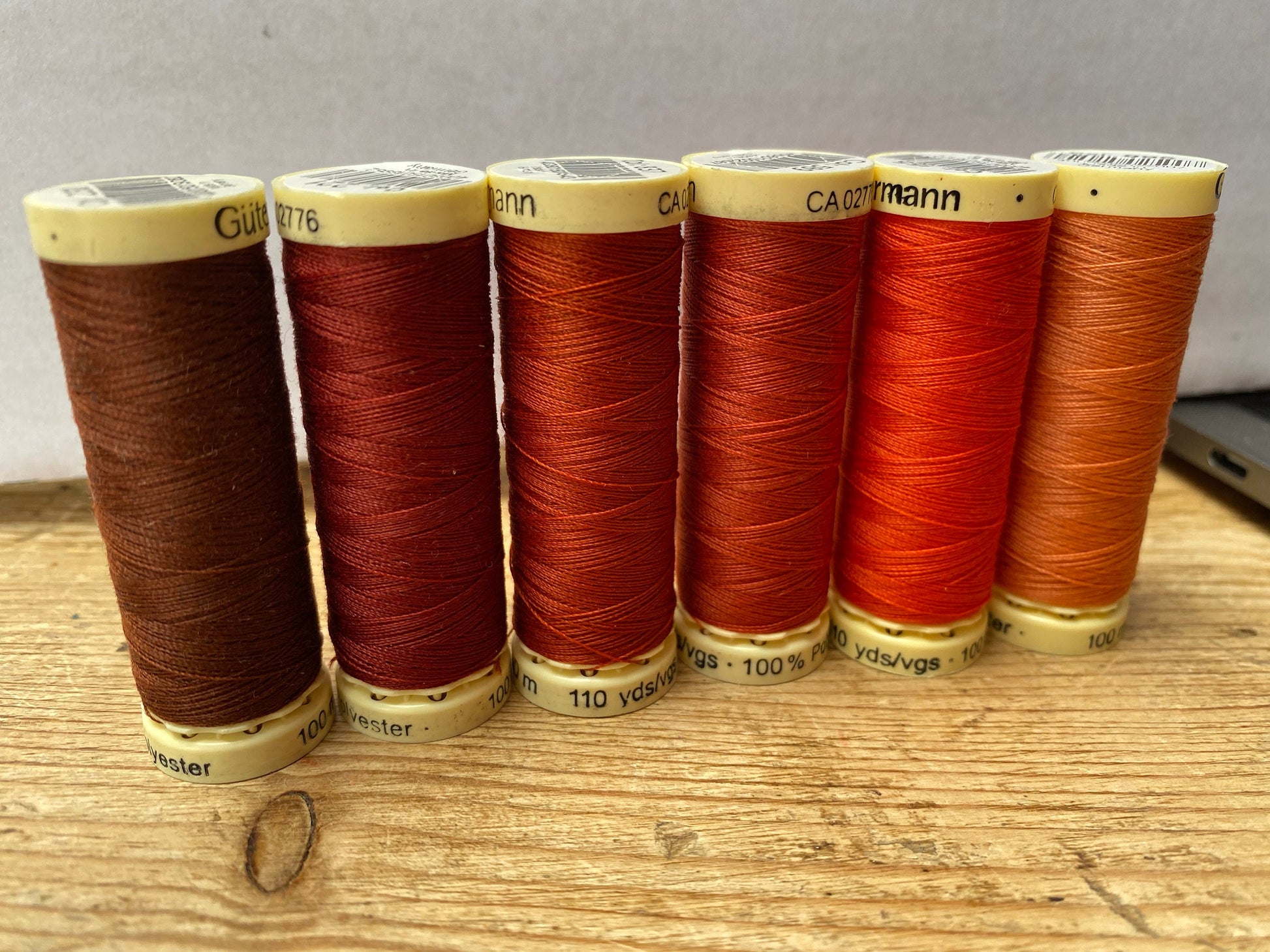 Gutterman sew all thread, orange tones, 100% Polyester, 100metres